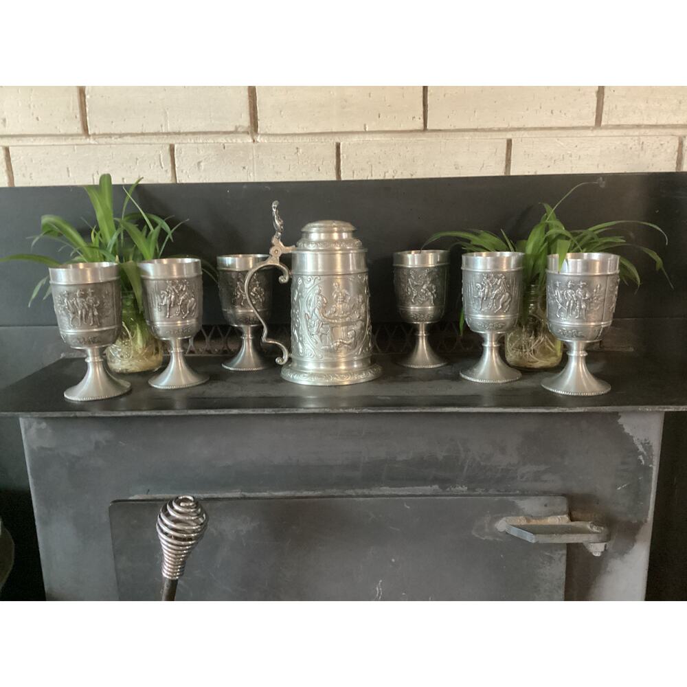 A Vintage German Pewter Stein and six matching Goblets